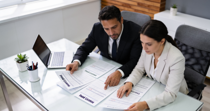 Restaurant owner holding FSSAI licence — food safety compliance for dine-in and takeaway businesses